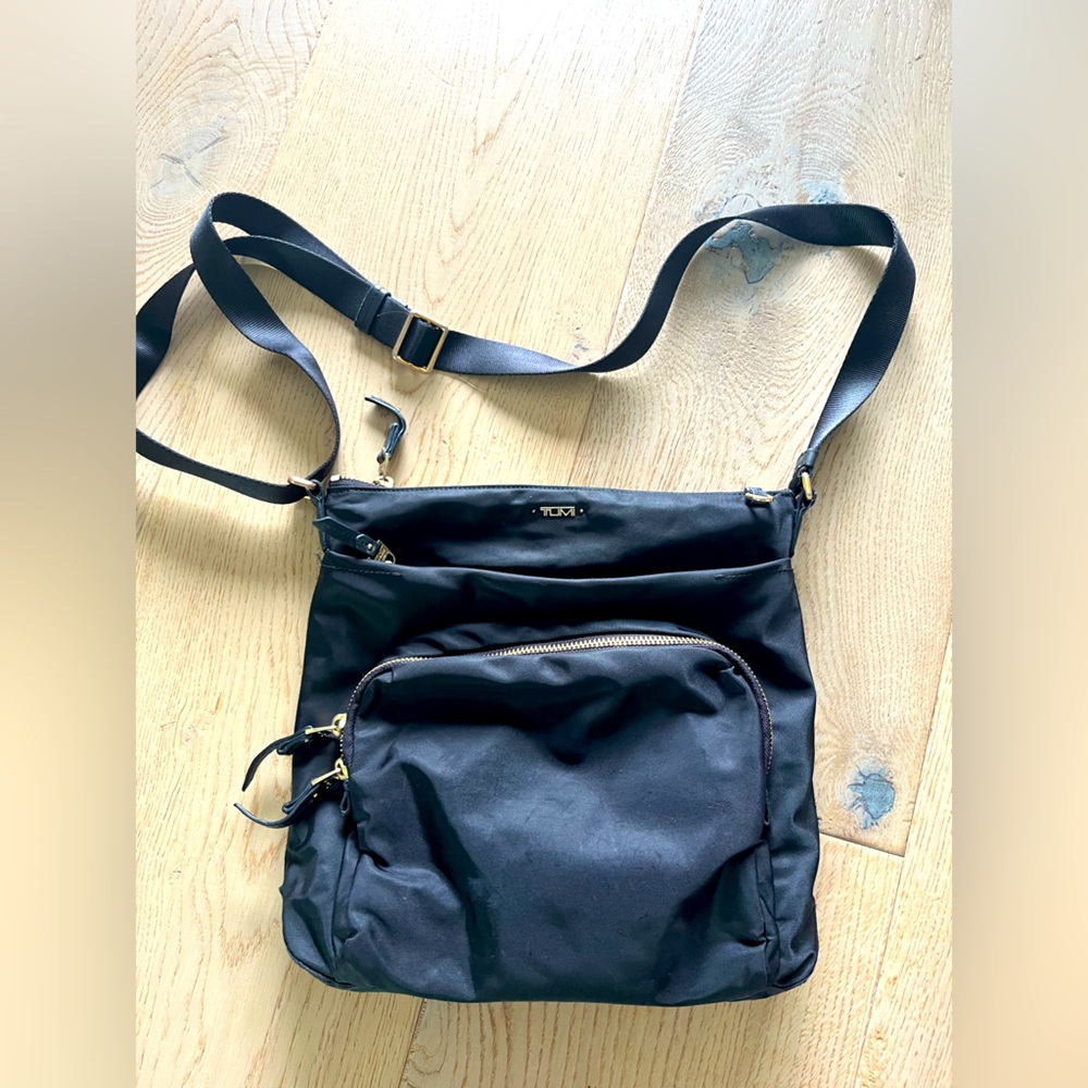 Tumi black nylon crossbody bag.